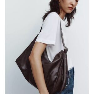 Zara large soft bucket bag with metal eyelets